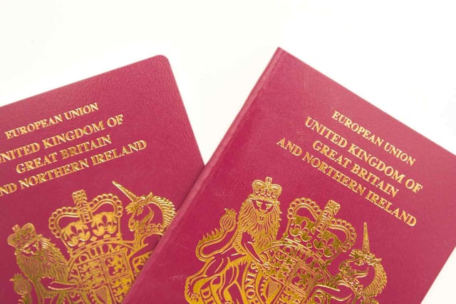 Uk Passports On A White Background